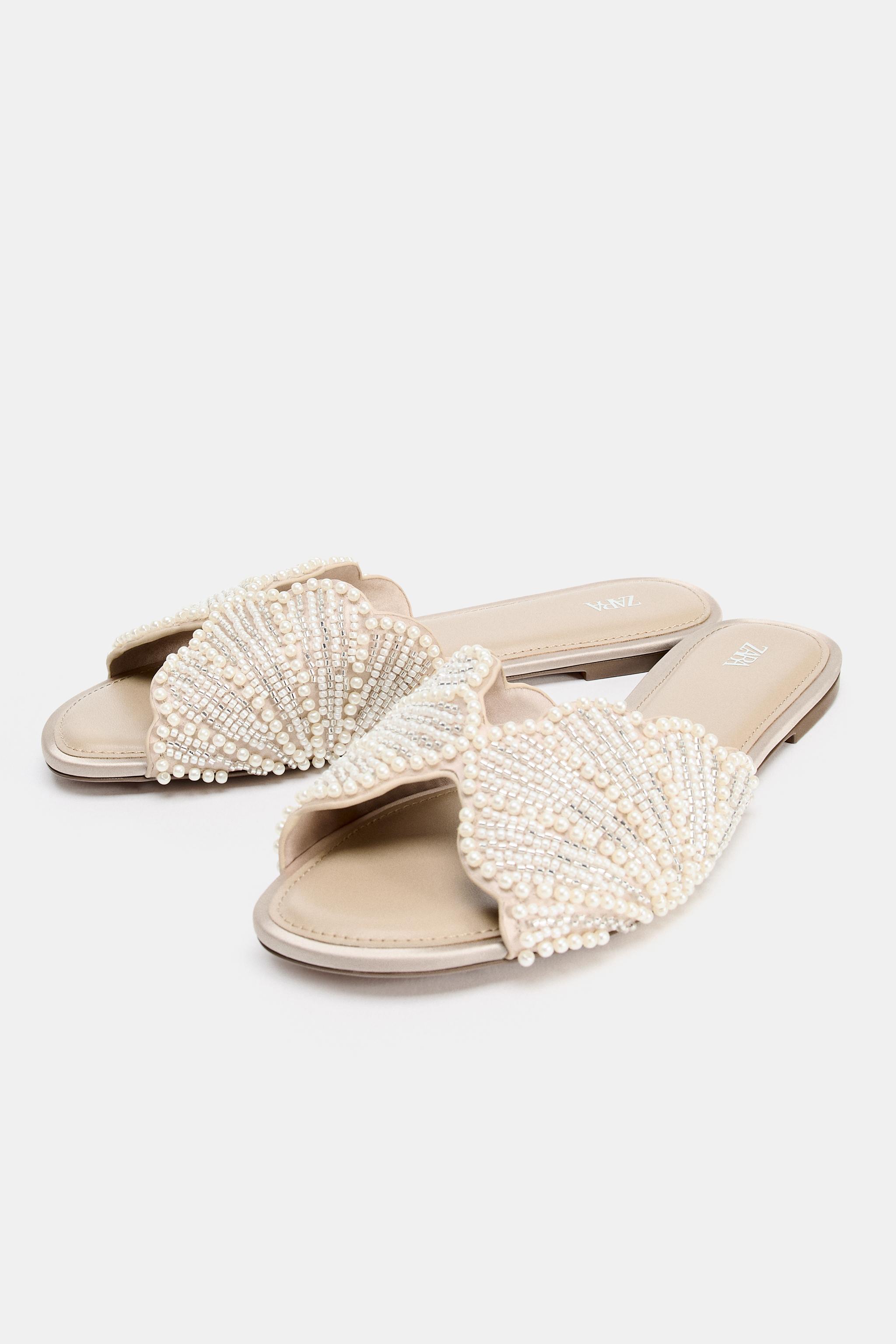 FLAT SANDAL WITH SHINY APPLIQUES